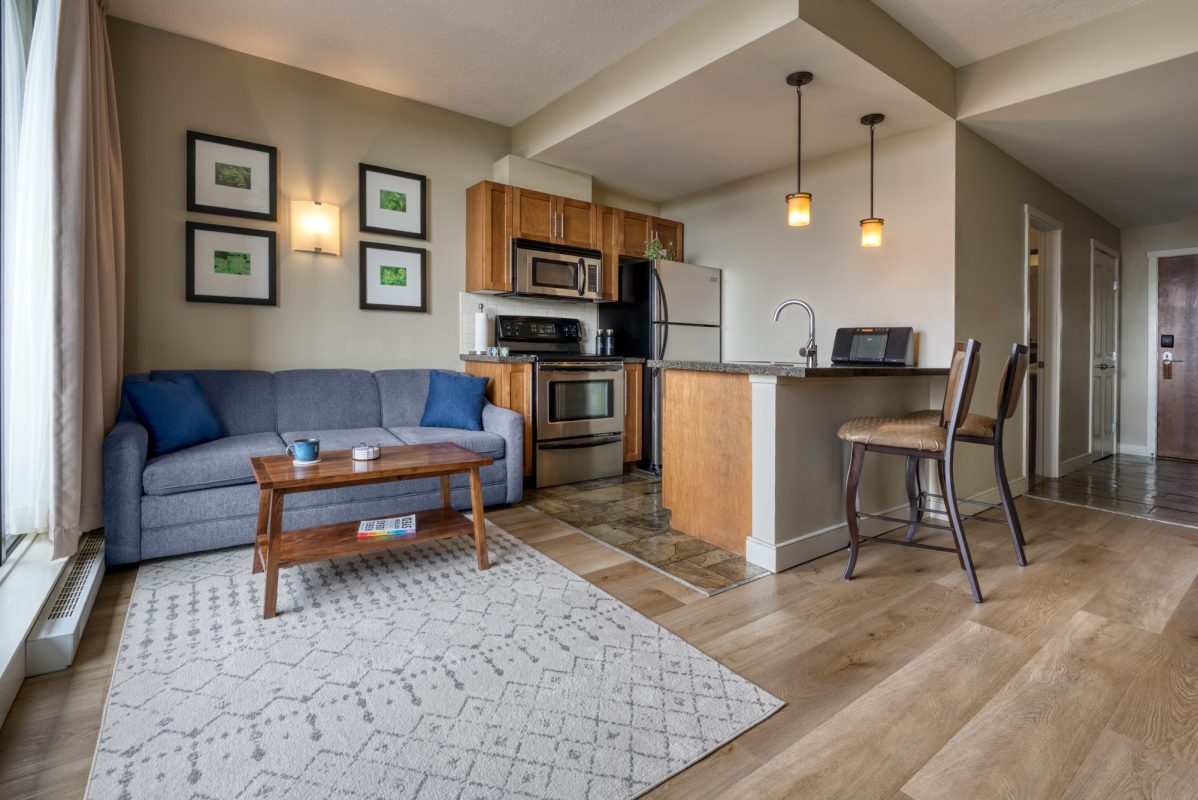 living-room-facing-kitchen-lights-on